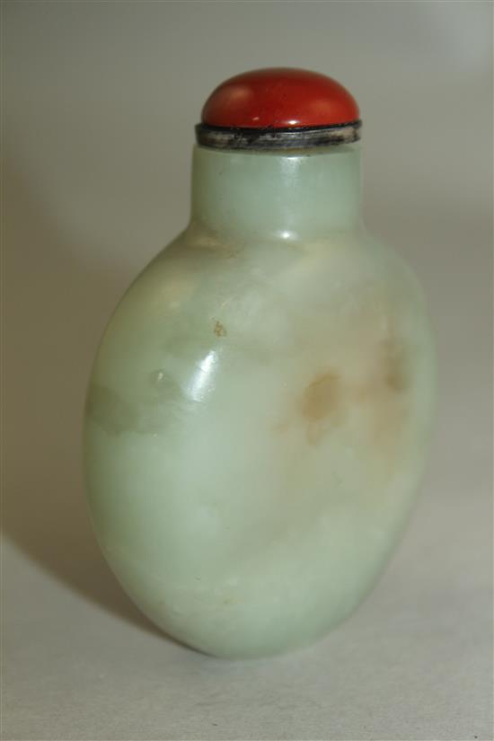 A Chinese pale celadon and russet jade snuff bottle, 6.5cm